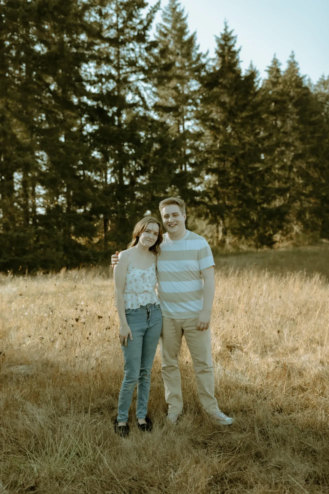 Caleb and Madeline of Salty Sea Bookkeeping standing together outdoors near Port Alberni, BC